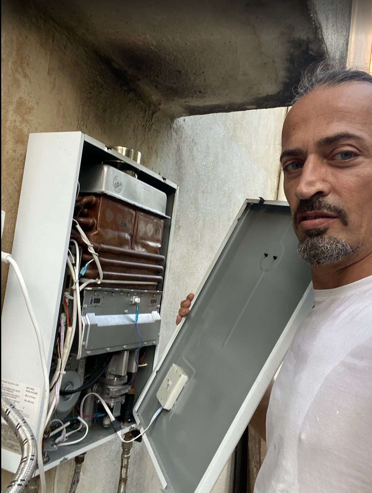 Gas water heater opened for service