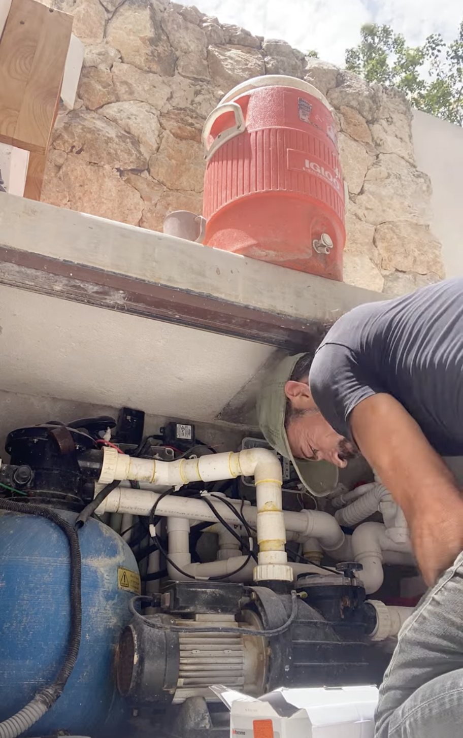 Pool pump and filtration equipment being serviced in Tulum