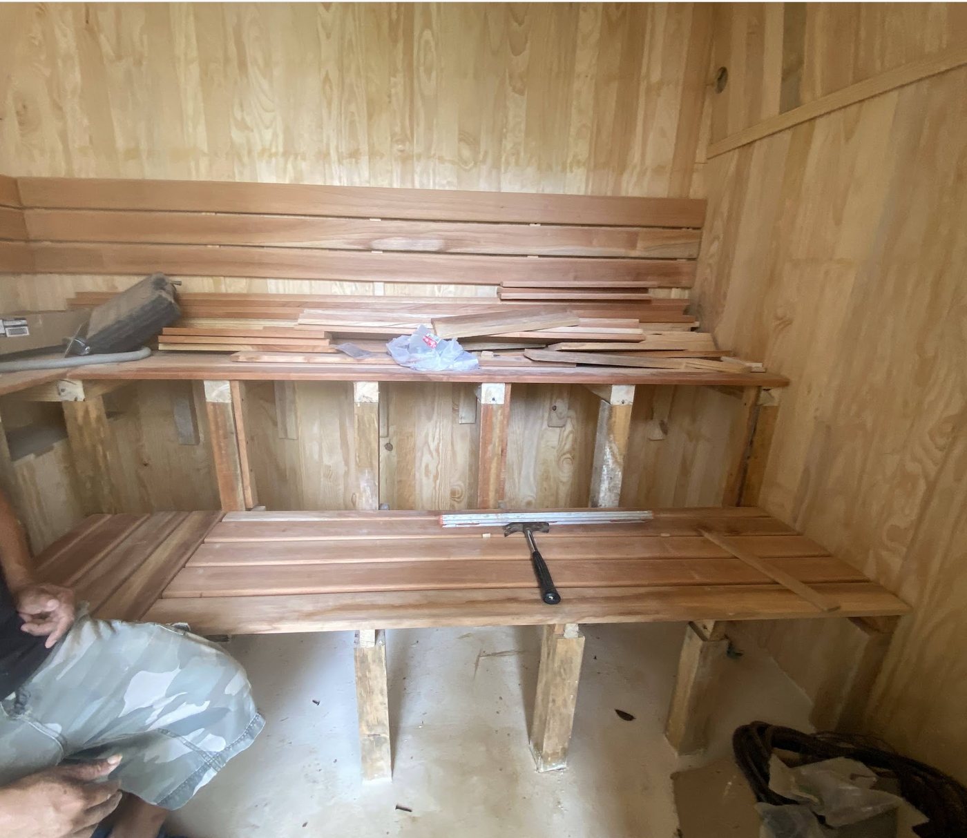 Cedar benches being fitted inside a custom sauna