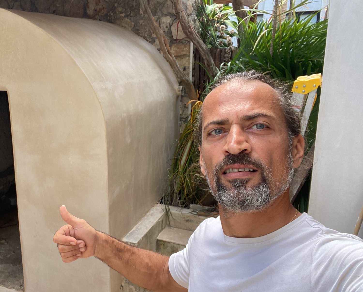Vaulted plastered sauna shell built in a Tulum garden