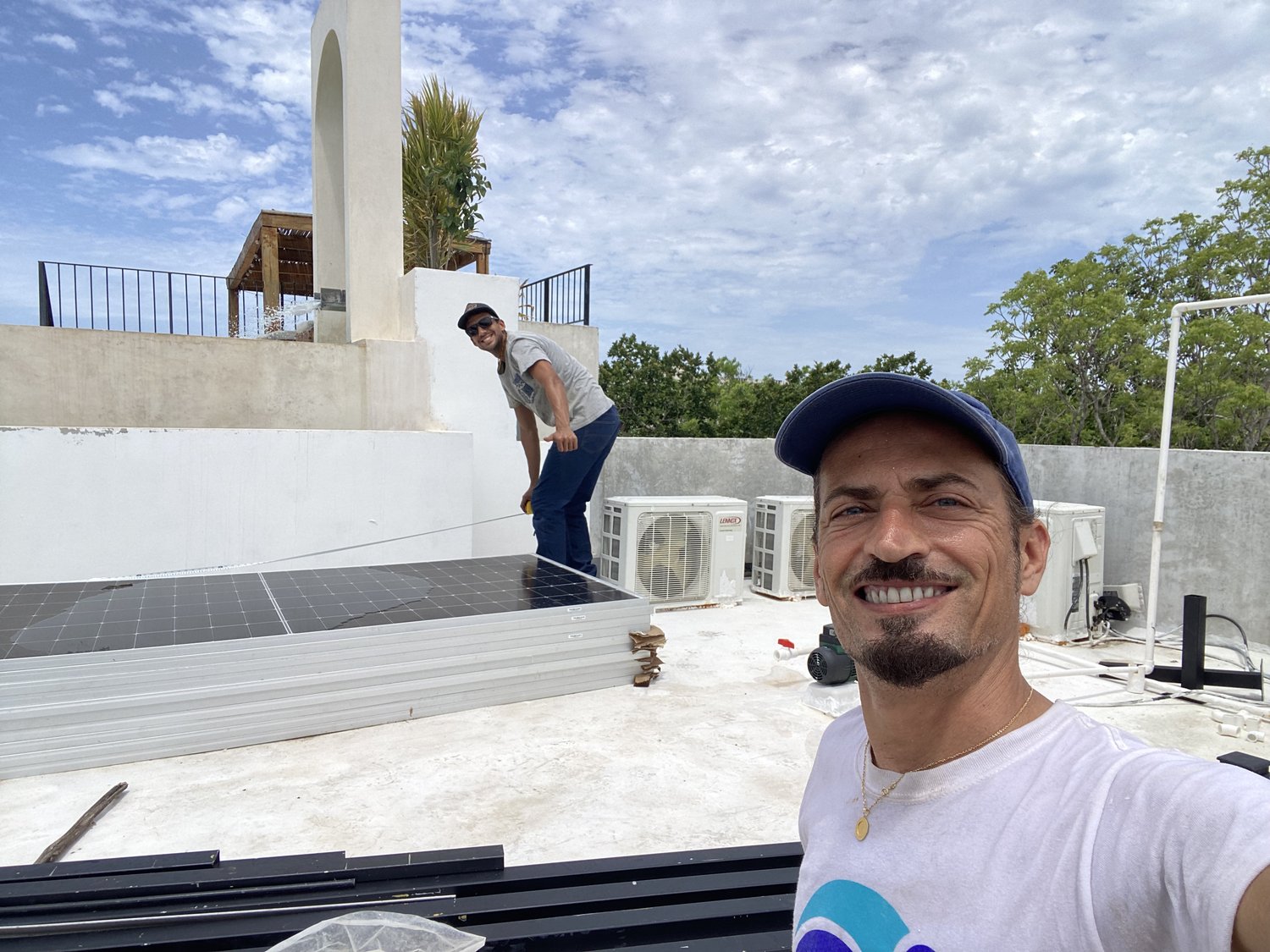 Lorenzo Del Bufalo and his team installing solar panels on a Tulum rooftop
